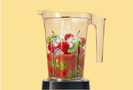 A blender filled with fruit and ice